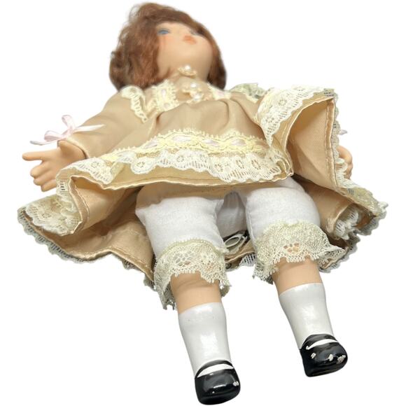 Porcelain Girl Doll in Champagne Satin Dress with Auburn Hair - Picture 11 of 11